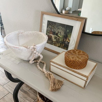 wooden bead garland on a decorative bowl