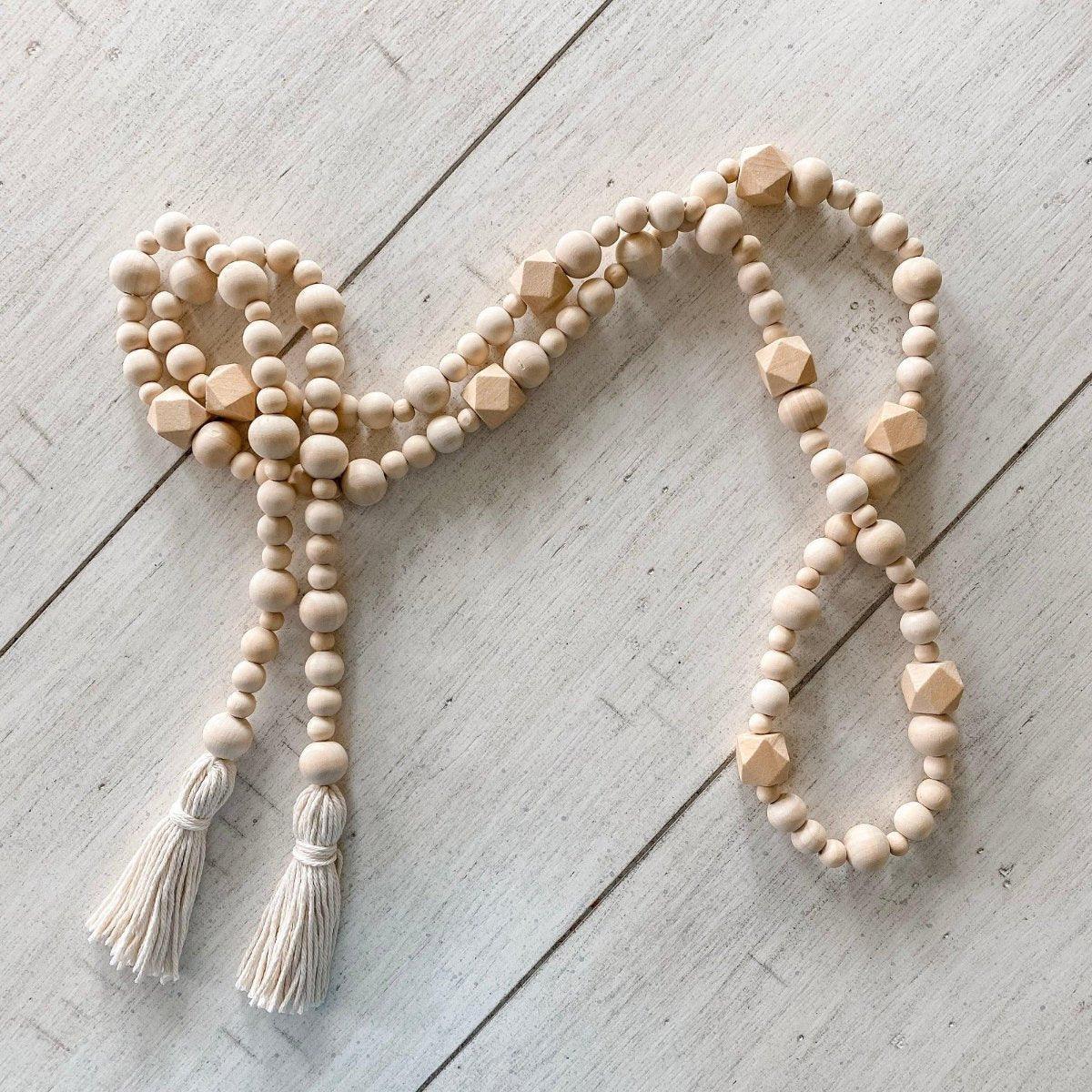 Geometric wood bead garland with tassels - Deco Azul